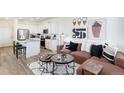 Stylish living room showcasing contemporary design elements and a view of the modern kitchen at 956 Andrews Crest Dr, Berthoud, CO 80513