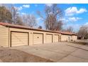 View of the four-car detached garage with alley access and lots of parking space at 2695 S Josephine St, Denver, CO 80210