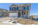 Charming two-story home features a large driveway, two-car garage, and covered front porch at 3226 Belleville Ridge Rd, Elizabeth, CO 80107