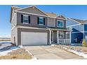 Charming two-story home features a large driveway, two-car garage, and covered front porch at 3226 Belleville Ridge Rd, Elizabeth, CO 80107