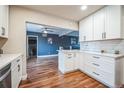 Open concept kitchen showcasing modern cabinets, sleek countertops, and a seamless flow to the living space at 840 Tucson St, Aurora, CO 80011