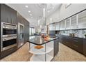 Gourmet kitchen with stainless steel appliances, granite counters, and a spacious center island at 1175 Ridge Oaks Dr, Castle Rock, CO 80104