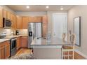 Modern kitchen with granite countertops, stainless appliances, and ample cabinet space at 14341 E Tennessee Ave # 203, Aurora, CO 80012