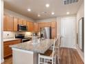Modern kitchen with granite countertops, stainless appliances, and ample cabinet space at 14341 E Tennessee Ave # 203, Aurora, CO 80012