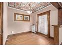 Dining room featuring hardwood floors, decorative ceiling, and original features at 1601 Jackson St, Denver, CO 80206