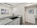 Bright kitchen featuring granite countertops and stainless steel appliances at 2880 S Locust St # 704N, Denver, CO 80222