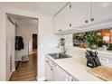 Functional kitchen features stainless steel appliances and a serving window at 12512 E Cornell Ave # 304, Aurora, CO 80014