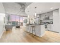 Open floorplan featuring a modern kitchen with stainless steel appliances and a breakfast bar at 891 14Th St # 2914, Denver, CO 80202