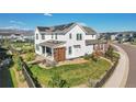 Aerial view of a home's backyard with a covered patio and solar panels on the roof at 11269 Star Streak Rd, Littleton, CO 80125