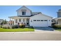 Charming two-story home with a covered front porch and well-maintained lawn at 11269 Star Streak Rd, Littleton, CO 80125