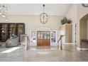 Open foyer with high ceilings and gorgeous chandelier at 4121 S Allison St, Denver, CO 80235