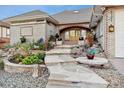 Stone walkway leading to the front door of this beautiful brick house at 4121 S Allison St, Denver, CO 80235