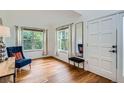 Bright living room with hardwood floors, large windows, and elegant décor accents at 912 S Galena St, Aurora, CO 80247