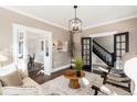 Bright living room featuring hardwood floors and a view to the dining room at 319 13Th Ave, Idaho Springs, CO 80452