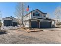 Lovely home with a fenced yard and a detached garage, perfect for storage at 16651 Tree Haven St, Hudson, CO 80642
