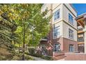 A well-maintained exterior showcasing brick and stucco architecture, complemented by green landscaping at 5401 S Park Terrace Ave # 301C, Greenwood Village, CO 80111