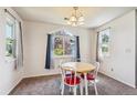 Bright dining room with a table and four chairs at 4333 S Andes Way # 204, Aurora, CO 80015