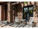 Cozy outdoor patio with chairs and a small table, perfect for enjoying the tranquil surroundings at 1143 S Saint Paul St, Denver, CO 80210