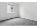 Clean bedroom with neutral carpet, baseboard trim and natural light coming from the window at 39161 Anthony St, Elizabeth, CO 80107