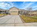 House exterior featuring a front yard and attached garage at 4280 Crystal Dr, Broomfield, CO 80023