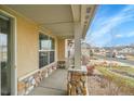 Covered porch with stone accents and a view of the neighborhood at 4280 Crystal Dr, Broomfield, CO 80023