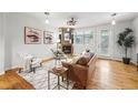Bright living room featuring a fireplace, hardwood floors, and neutral decor at 2319 Decatur St, Denver, CO 80211
