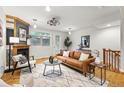 Stylish living room with hardwood floors, fireplace, and modern furnishings at 2319 Decatur St, Denver, CO 80211