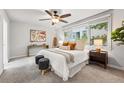 Bright main bedroom features large windows and neutral decor at 2319 Decatur St, Denver, CO 80211