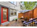 Cozy patio area with string lights, outdoor seating, and privacy fence at 2319 Decatur St, Denver, CO 80211
