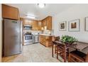 Cozy kitchen with stainless steel appliances and light wood cabinets at 715 S Alton Way # 5D, Denver, CO 80247