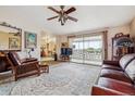 Comfortable living room with large windows and neutral carpet at 715 S Alton Way # 5D, Denver, CO 80247