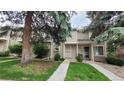 Charming townhome with well-maintained lawn and mature trees at 1818 S Quebec Way # 5-7, Denver, CO 80231