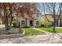 Two-story home with meticulously maintained front yard and beautiful landscaping at 2500 S Monroe St, Denver, CO 80210