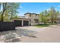 Rear exterior showcasing a three-car garage and well-maintained landscaping at 2500 S Monroe St, Denver, CO 80210