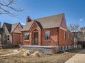 A cozy brick home with a traditional design and appealing curb appeal at 3921 N Raleigh St, Denver, CO 80212