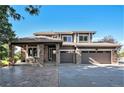 Beautiful two-story home boasting a three-car garage, covered porch, and landscaped front yard at 10731 E 151St Pl, Brighton, CO 80602