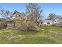 Backyard view with mature lawn and landscaping at 1824 S Logan St, Denver, CO 80210
