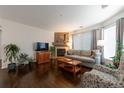 Comfortable living room with fireplace and ample natural light at 8338 S Independence Cir # 108, Littleton, CO 80128