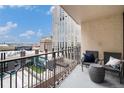 City views from this balcony with metal railing featuring patio furniture and exterior design at 1020 15Th St # 9N, Denver, CO 80202