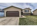 Lovely home with a two-car garage, well-maintained lawn, and classic architecture at 3762 S Halifax St, Aurora, CO 80013