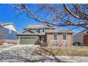 Beautiful home featuring a three-car garage and well-manicured lawn at 23593 E Eads Dr, Aurora, CO 80016