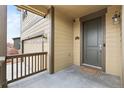 Close-up of a charming front porch, showcasing the entrance and a 'welcome' mat, exuding a warm, inviting feel at 19120 E Pacific Pl, Aurora, CO 80013