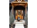 Inviting front entryway featuring a wood door with glass panels and a decorative wreath at 2951 S Logan St, Englewood, CO 80113