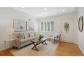 Bright living room with hardwood floors, neutral decor, and ample natural light at 1080 S Garfield St, Denver, CO 80209