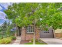 Charming home with a well-kept lawn, colorful landscaping, and a welcoming entrance at 3070 Redhaven Way, Highlands Ranch, CO 80126