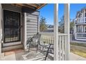 Cozy patio with seating area, perfect for enjoying the outdoors and relaxing at 8331 S Upham Way # 101, Littleton, CO 80128