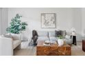 Cozy living room with a comfortable sofa, stylish decor, and ample natural light creating a relaxing ambiance at 9453 W Utah Pl, Lakewood, CO 80232