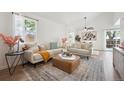 Bright living room with vaulted ceilings, a ceiling fan, and lots of natural light at 15942 E Rice Pl # B, Aurora, CO 80015
