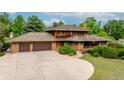 Charming two-story home with a spacious driveway and a well-maintained yard at 1961 S Xenia Ct, Denver, CO 80231