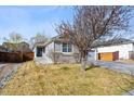 Charming single-Gathering home with a manicured front yard and a two-car garage at 16351 E 104Th Pl, Commerce City, CO 80022